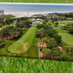 Aerial golf course view showing fairways, greens and course layout