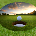 Golf ball positioned near the hole on a putting green